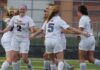 female football player sits out for her team mates