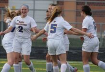 female football player sits out for her team mates